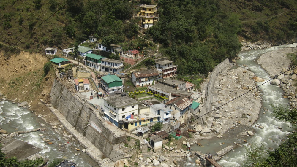 The town is lined with large stone and concrete walls that reinforce the structure.